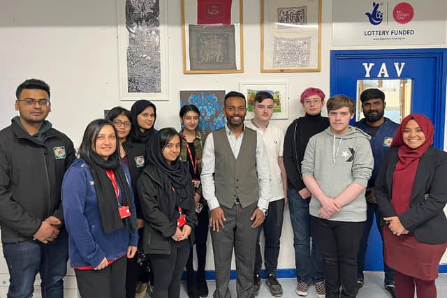 Some of the YAV team with part of the Sans Street exhibition, including executive manager Ram (centre) and Mahnur Roushan from Sunderland Culture, right.