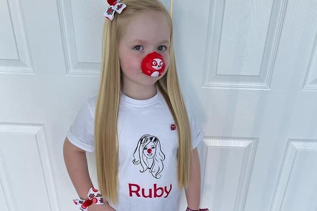 Red by nature! Ruby, age 6, ready for her day at Bexhill Academy.