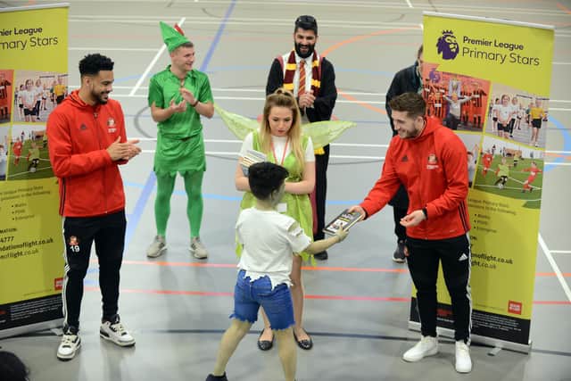 SAFC Foundation of Light supporting World Book Day with players Jordan Willis and Lyndon Gooch (R) handing out gifts for best dressed