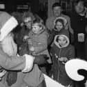 Which stocking fillers do you remember most fondly from your childhood? Youngsters are pictured here meeting Santa Claus at Littlewoods, Sunderland, in December 1983. Santa with children outside Littlewoods in December 1983.