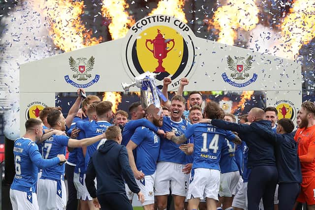 GLASGOW, SCOTLAND - MAY 22: St Johnstone captain Jason Kerr lifts the trophy following the Scottish Cup Final between Hibernian and St Johnstone at Hampden Park on May 22, 2021 in Glasgow, Scotland. A limited number of fans will be allowed into the stadium as Coronavirus restrictions begin to ease in the UK. (Photo by Ian MacNicol/Getty Images)