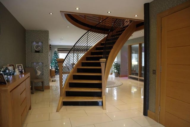 A beautifully crafted staircase shows the workmanship and attention to detail the current owners have lavished on this home.