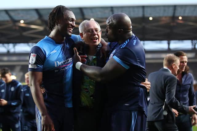 MILTON KEYNES, ENGLAND - MAY 08: Rob Couhig, Chairman of Wycombe Wanderers, celebrates with Anthony Stewart and Adebayo Akinfenwa of Wycombe Wanderers after progressing to the Sky Bet League One Play-Off Final after victory in the Sky Bet League One Play-Off Semi Final 2nd Leg match between Milton Keynes Dons and at Stadium mk on May 08, 2022 in Milton Keynes, England. (Photo by Marc Atkins/Getty Images)