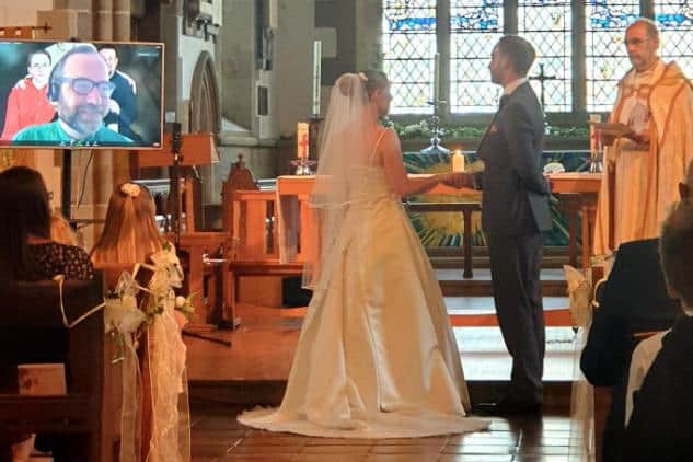 The happy couple pictured during their wedding ceremony at Sunderland Minster, as Reverend Chris Howson, the groom's brother, and Canon Provost Stuart Bain led the service. Photo by Zoe Heslop.
