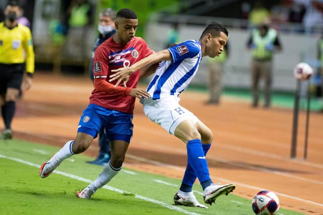 Costa Rica's Jewison Bennette (L) vies for the ball with Honduras´ Carlos Melendez during their FIFA World Cup Qatar 2022 Central American qualifier match at the Romel Fernandez stadium in Panama City on November 16, 2021. (Photo by Ezequiel BECERRA / AFP) (Photo by EZEQUIEL BECERRA/AFP via Getty Images)