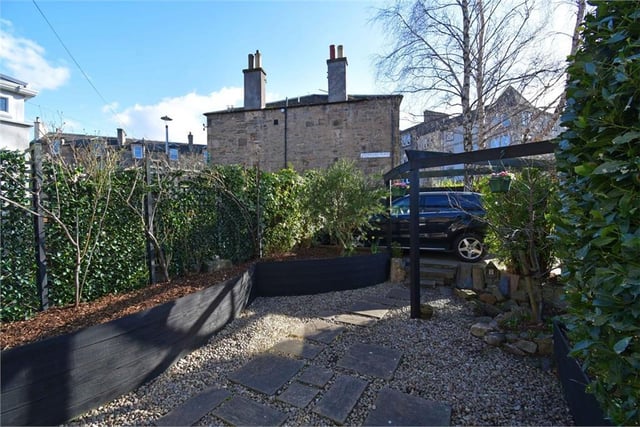 Rear garden with off-street parking space.
