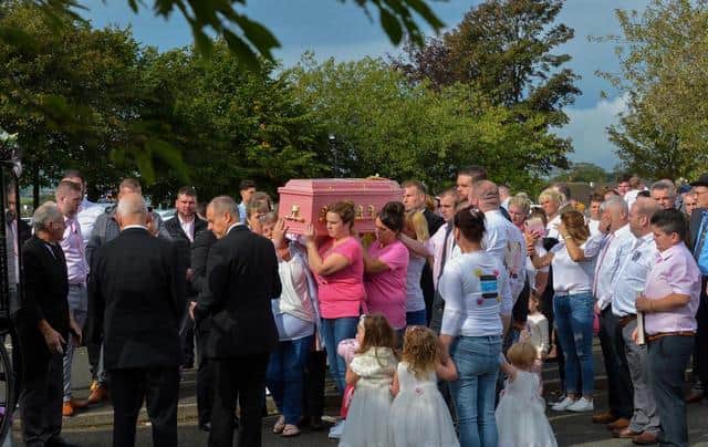 A huge number of people turned out to pay their respects to the cousins at their funeral in Northern Ireland