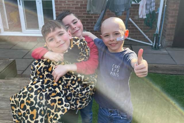 Oliver (right) is fighting stage four neuroblastoma. Pictured with identical brothers Owen (left) and Oscar (middle).