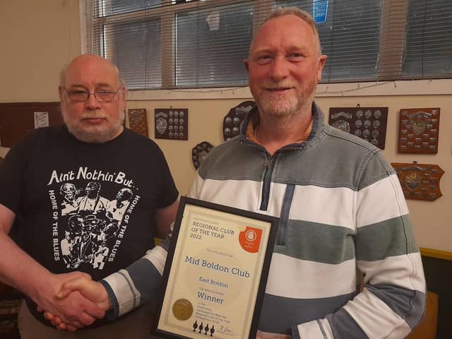 CAMRA’s North East regional director Hubert Gieschen, left, presents the award to Steve Drummond of the Mid Boldon Club.