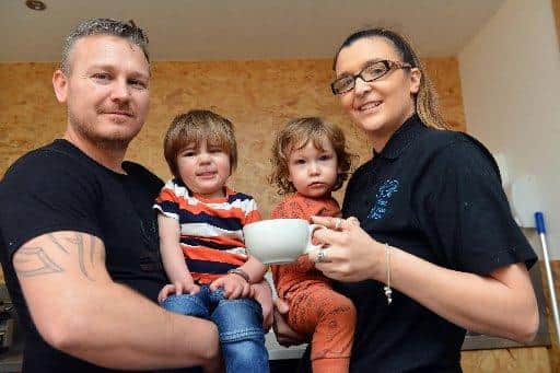 Lee Nicholson and partner Tori Hetherington with two of their children at the Bee Bees Coffee House.