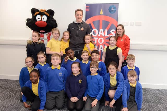 Sunderland AFC goalkeeper Thorben Hoffmann with children from Dame Dorothy Primary School as part of the Foundation of Light's Coals to Goals initiative.

Photograph: Alan Hewson