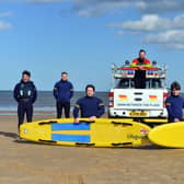 RNLI lifeguards training ready for the summer season with a stay safe summer of staycation message.
