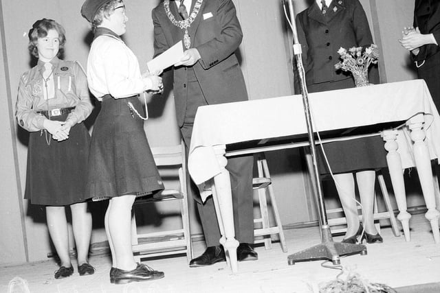 Ranger Alison Smith receives her Silver Duke of Edinburgh Award from Lord Provost Duncan Weatherstone at the Girl Guide Exhibition in Waverley Market in March 1964.