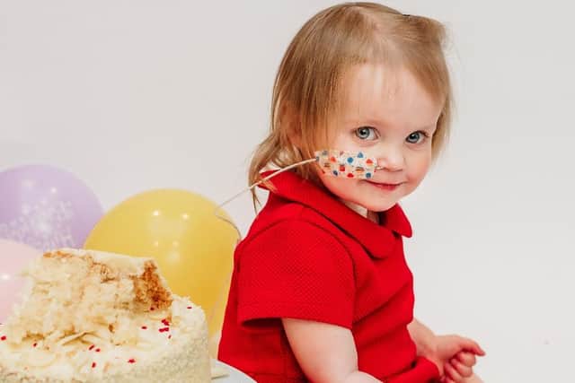 Cake and balloons for birthday girl Beatrix Archbold. Photo: Emma Hewitt Photography.