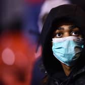 NOTTINGHAM, ENGLAND - MARCH 06: A fan wears a face mask as protection from Coronavirus during the Sky Bet Championship match between Nottingham Forest and Millwall at City Ground on March 06, 2020 in Nottingham, England. (Photo by Nathan Stirk/Getty Images)