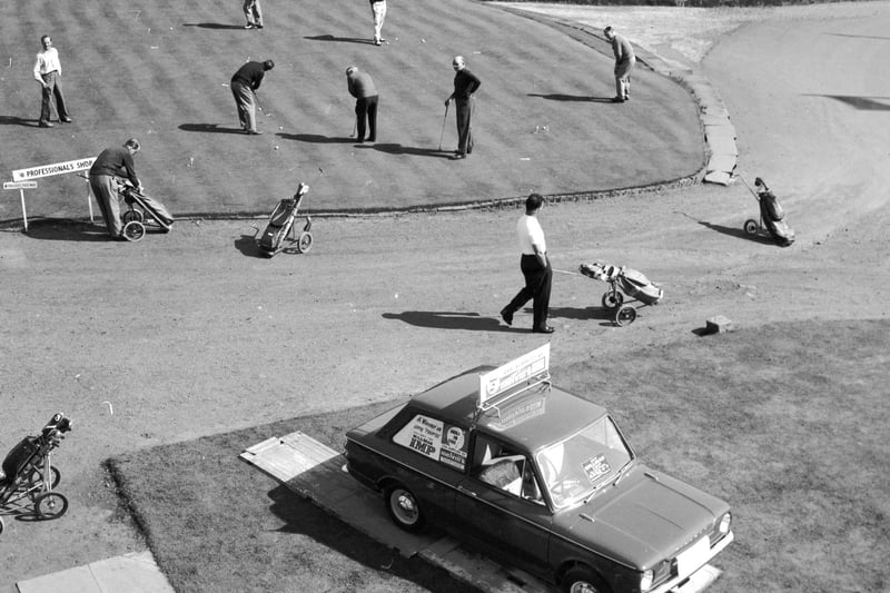 Golfers practice their putting at Drumpellier golf course at Coatbridge in September 1964. A Hillman Imp was the prize for a hole-in-one.