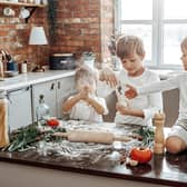 Children love getting involved in preparing food in the kitchen.