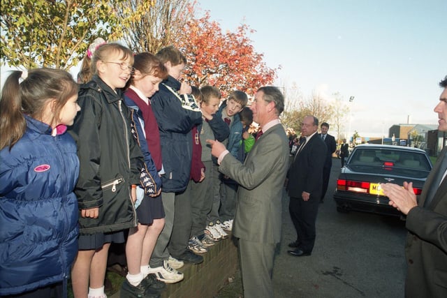 Children lining up to greet Prince Charles during his visit to Pennywell 25 years ago.