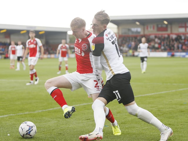 Curtis is booked in the 43rd minute by referee Ben Speedie for a late challenge on Jordan Rossiter.