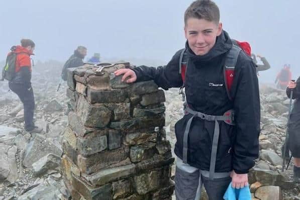 Riley Greener, 15, on the summit of Scafell Pike.