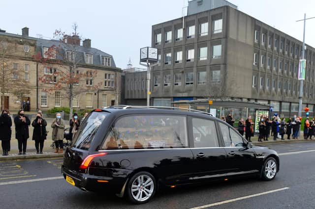 The funeral cortege for John Hays passes through Keel Square as Hays Travel staff pay respect.