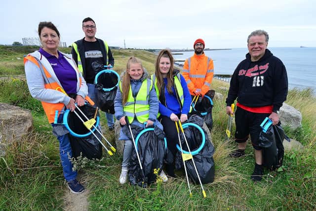 Volunteer litter pickers Peter Healey, Matthew Harrison, Michael Mordey, Beverley Donkin, Michael Noble and Ebony Cook, on the clifftops above Hendon Beach.  

Picture by Frank Reid