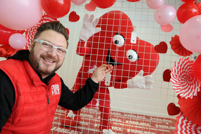 Red Sky Foundation's Sergio Petrucci with the heart wall at The Bridge's Sunderland.