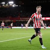 SHEFFIELD, ENGLAND - DECEMBER 26: Tommy Doyle of Sheffield United celebrates after scoring their side's third goal during the Sky Bet Championship between Sheffield United and Coventry City at Bramall Lane on December 26, 2022 in Sheffield, England. (Photo by George Wood/Getty Images)