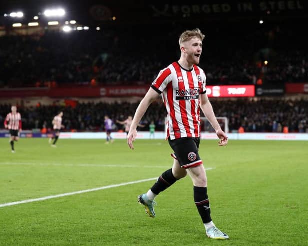 SHEFFIELD, ENGLAND - DECEMBER 26: Tommy Doyle of Sheffield United celebrates after scoring their side's third goal during the Sky Bet Championship between Sheffield United and Coventry City at Bramall Lane on December 26, 2022 in Sheffield, England. (Photo by George Wood/Getty Images)