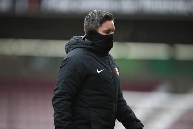 Sunderland manager Lee Johnson walks from the pitch prior to the Sky Bet League One match between Northampton Town and Sunderland at PTS Academy Stadium on January 2, 2021.