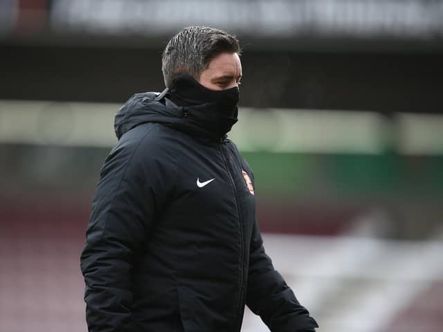 Sunderland manager Lee Johnson walks from the pitch prior to the Sky Bet League One match between Northampton Town and Sunderland at PTS Academy Stadium on January 2, 2021.