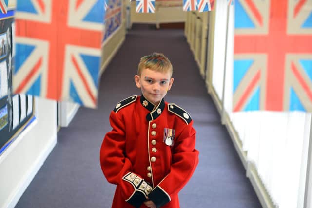 Hastings Hill Academy pupil Anthony Martin, 9, wearing an official uniform of the Queen's Guard.