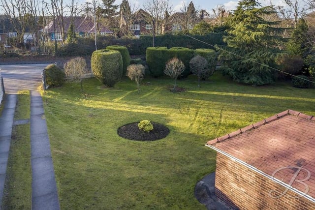 The drone has also captured this aerial shot of the front garden and driveway. The shrubs and trees are strategically positioned to add to the feeling of privacy.