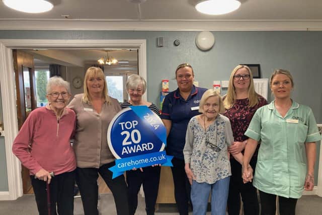 Residents and team members at Maple Lodge Care Home with the carehome.co.uk Top 20 Award