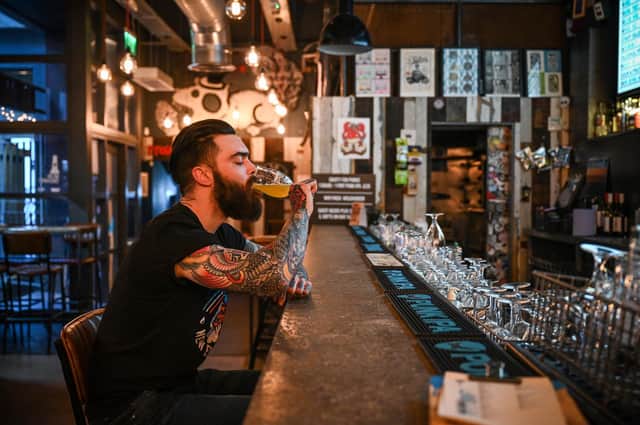 A man drinks in another branch of BrewDog.