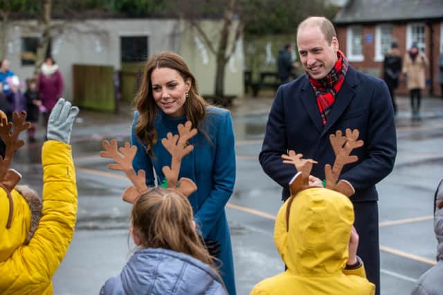 Children wore their own reindeer antlers as they met Duke and Duchess of Cambridge during the visit to their school.
