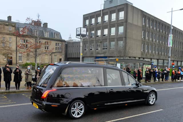 Funeral cortege for John Hays passes through Keel Square as Hays Travel staff pay respect.