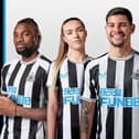 Allan Saint-Maximin, Olivia Watt, Bruno Guimaraes, Katie Barker and Kieran Trippier model Newcastle United's 2022/23 home shirt.
