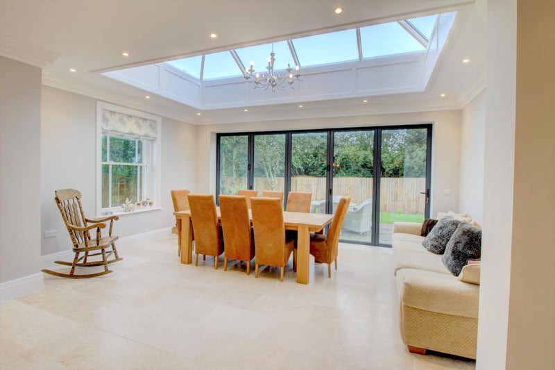 It boasts a fully tiled floor and an elegant full wall of bi-fold doors that open out onto an alfresco dining area to the side of the property, an absolutely perfect place for entertaining..