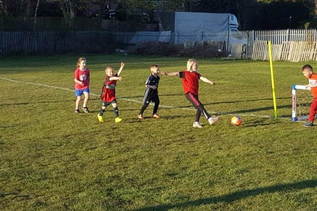 Young footballers enjoying the Washington Athletic Mini Kickers sessions