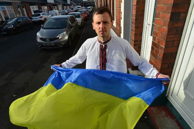Simon Cyhanko in traditional Ukrainian dress and holding the Ukrainian flag outside of his Sunderland home. Simon is pleading with western governments to do all they can to prevent Russian forces invading Ukraine.

Picture by FRANK REID