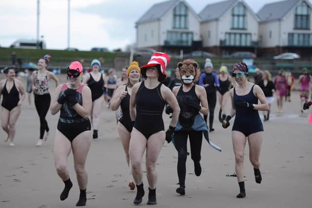 Early risers take part in a sunrise swim at Seaburn beach in Sunderland this morning (SUN), in support of International Women’s Day and organised by members of Roker’s Fausto Bathing Club, with sponsorship and donations collected for Wearside Women in Need.
Pics by: North News