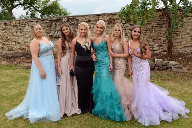 Year 11 girls pose for a group photograph in the garden of Hallgarth Manor House in Durham.