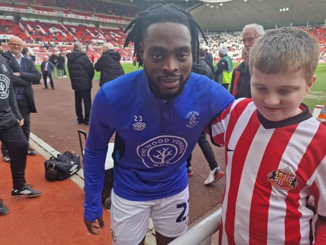 Jack Berry with Luton Town FC player Fred Onyedinma.