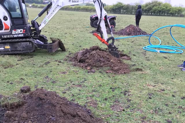 Rescuers had to dig four holes to locate the lamb.