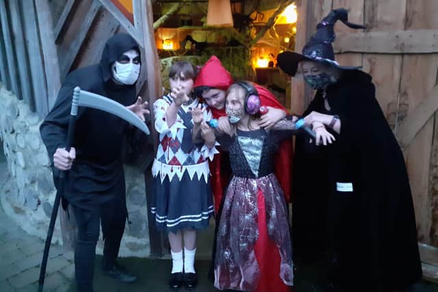 The Grim Reaper and wicked witch, AKA teacher and higher level teaching assistant Gavin Briggs and Dawne Taylor,  along with (left to right) Crystal Sinnott, 8, Maddison Sinnott, 11, and Ava Sinnott, 8.