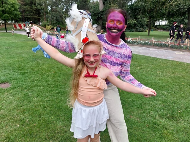 Natasha Black and her seven-year-old daughter Nancy dancing to the music in Mowbray Park after visiting the Winter Gardens' Alice in Wonderland-themed event.
