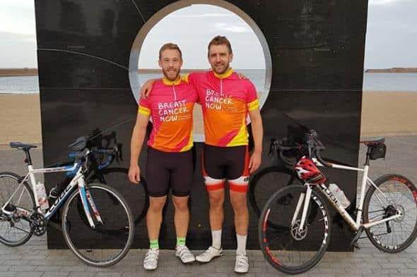 Jack Royle and Craig Duff after completing their 138 mile coast to coast ride at Roker in Sunderland.