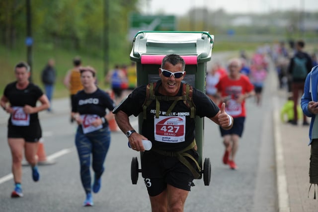 One competitor was seen running with a wheelie bin on his back.