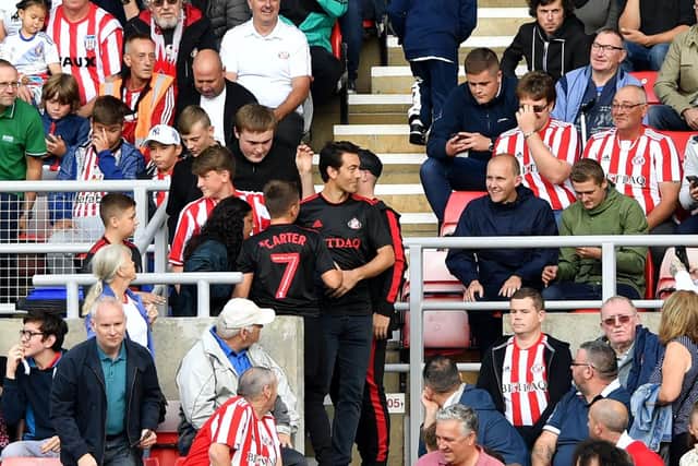 Sunderland fans with new director Juan Satori. 